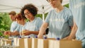 Portrait of a Black Latina Female Volunteer Preparing Free Food Delivery for Low Income People