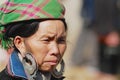 Portrait of a Black Miao Hmong minority woman wearing traditional costume at the street in Sapa, Vietnam.