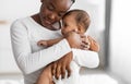 Portrait of black mother holding baby on hands Royalty Free Stock Photo