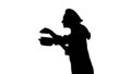 Portrait of black silhouette of a chef female in uniform smelling dish.