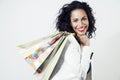 Portrait of black woman happy with perfect shopping paper bags, smiling face