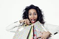 Portrait of black woman happy with perfect shopping paper bags