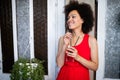 Portrait of a young black woman, model of fashion wearing dress with afro hairstyle Royalty Free Stock Photo