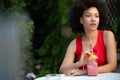 Portrait of a young black woman, model of fashion wearing dress with afro hairstyle Royalty Free Stock Photo