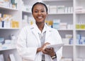 Portrait of black woman in pharmacy with tablet, smile and online inventory list for medicine on shelf. Happy female Royalty Free Stock Photo