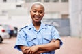 Portrait, black woman and security guard smile with arms crossed in surveillance service, safety and city patrol. Law Royalty Free Stock Photo