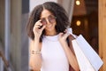 Portrait, black woman shopping at outdoor mall with shopping bag, retail and sale with discount at boutique. Designer Royalty Free Stock Photo