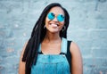 Portrait of black woman with sunglasses in the city and a smile on her face. Young fashion model, summer and happy girl Royalty Free Stock Photo