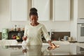 Young Woman Cleaning Kitchen Counters