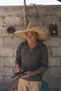 Portrait of blacksmith showing his finished work, chisels for carving stone.