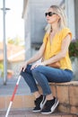 Portrait blind woman sitting outdoors