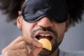 Portrait Of Blindfolded Man Tasting Food Royalty Free Stock Photo