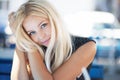 Portrait of a blond beautiful young woman in cafe