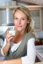 Portrait of blond woman drinking milk