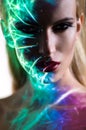 Portrait of blond Woman with shining lights on face Royalty Free Stock Photo