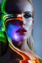 Portrait of blond Woman with shining lights on face Royalty Free Stock Photo