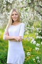 Portrait of blond woman in white dress outdoor Royalty Free Stock Photo