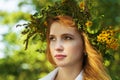 Portrait blond woman with a wreath of flowers on head