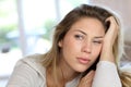 Portrait of blond young woman getting bored