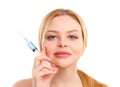 Portrait of a blonde woman isolated on white background, with a syringe in her hands, concept of medicine, plastic