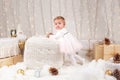 Caucasian baby girl with blue eyes looking in camera celebrating Christmas or New Year holiday Royalty Free Stock Photo
