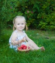 Portrait of blonde girl with red apples