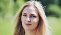 Portrait of a blonde girl of Slavic appearance. Close-up face.