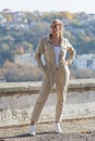 Portrait of blonde person in unbuttoned jumpsuit in public Park Royalty Free Stock Photo