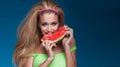 Portrait of blonde woman eating watermelon. Royalty Free Stock Photo