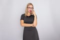 Portrait of blonde woman holding cup of coffee on white background Royalty Free Stock Photo