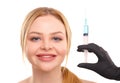 Portrait of a blonde woman isolated on white background, with syringe, concept of medicine, plastic surgery.