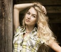 Portrait of Blonde Woman at the Wooden Background Royalty Free Stock Photo