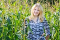 Portrait of blonde young woman in corn field Royalty Free Stock Photo