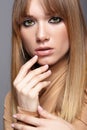 Portrait of blonde young woman. Female with green eyes and long Royalty Free Stock Photo