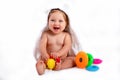 Portrait of a blue eyed baby girl playing with colorful rings Royalty Free Stock Photo