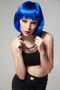 Portrait of blue-haired stylish woman in chain necklace Royalty Free Stock Photo