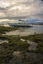 A portrait of a boat during sunset time.