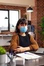 Portrait of bookkeeper woman with medical protection face mask