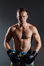 Portrait of boxer in Boxing gloves on gray background