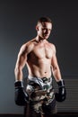 Portrait of boxer in Boxing gloves on gray background