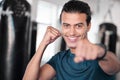 Portrait, boxer punch and smile of man in gym ready to start workout, training or exercise. Boxing sports, wellness face