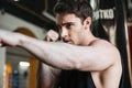 Portrait of boxer training in gym