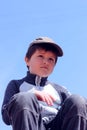 Portrait of a boy 7 years against the blue sky Royalty Free Stock Photo