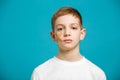 Portrait of a boy with adhesive plaster on his cheek