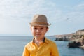 Portrait of a boy 4-7 against the background of mountains and the sea Royalty Free Stock Photo