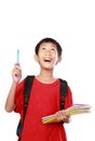 Portrait of boy with backpack pointing Royalty Free Stock Photo