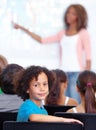 Portrait, boy child or student in classroom for knowledge, education or development for future growth. School, teacher Royalty Free Stock Photo