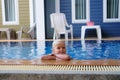 Portrait boy child in swimming pool home summer holiday, outdoors Royalty Free Stock Photo