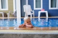 Portrait boy child in swimming pool home summer holiday, outdoors Royalty Free Stock Photo