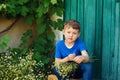 The boy is holding a bouquet of wild flowers Royalty Free Stock Photo